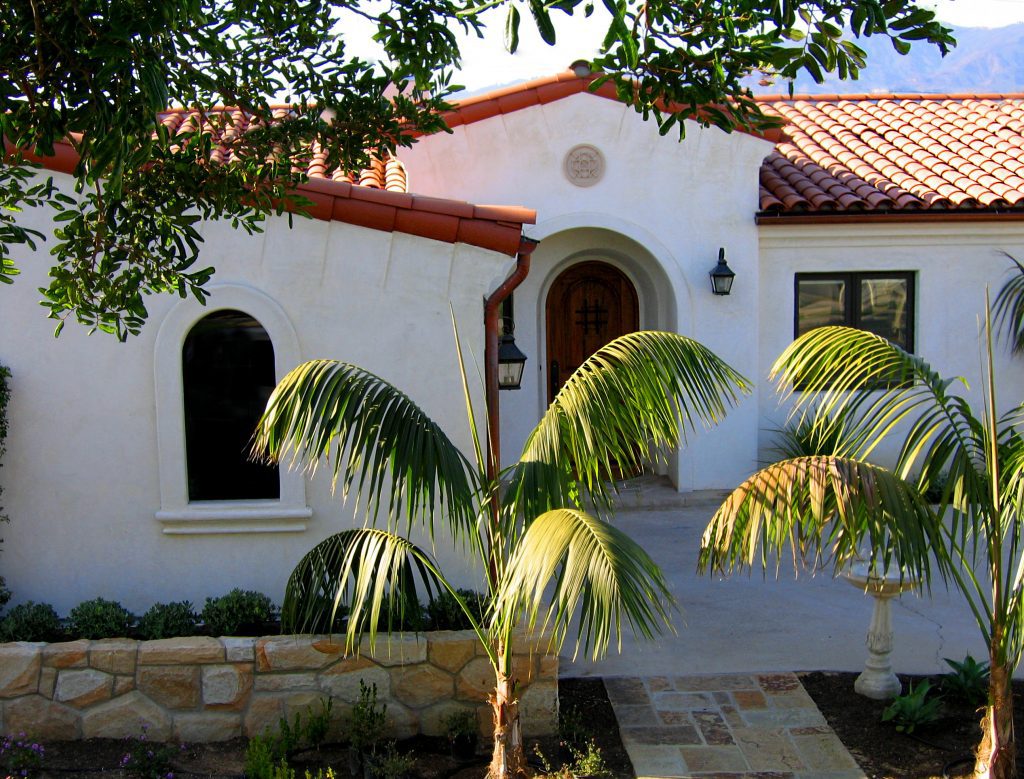 a Small One Level Spanish Style Home with Modest Entry Tower Designed by Jeff Doubet, a Santa Barbara Home Designer