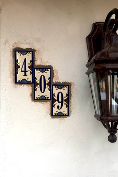 Spanish Deco Tile Numbers Are Glued to a Stucco Wall of a Spanish Style Home in Santa Barbara California and then Stucco Patch Was Applied