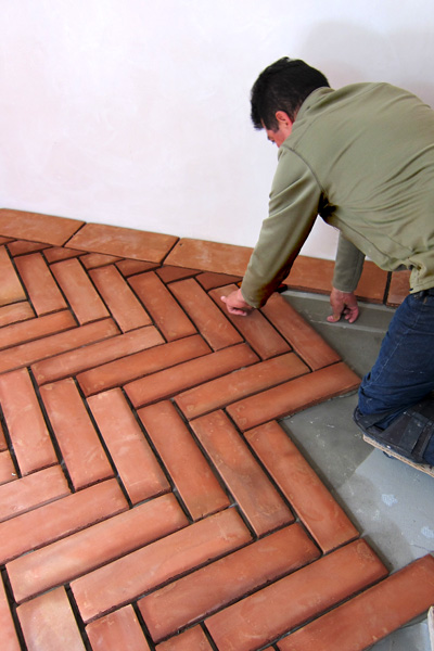 a Master Tile Setter in Santa Barbara Installs a Terra Cotta Clay Floor in a Herringbone Pattern in a Montecito California Spanish Colonial Revival Style Home Renovation