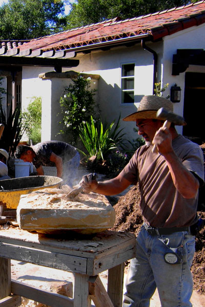 a Local Santa Barbara Stone Mason Works at Hand Chiseling a Sandstone Cap for a Stucco Column