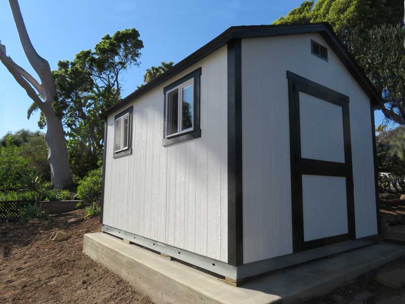 A new, basic 10x12 garden shed in santa barbara installed on a new cement slab